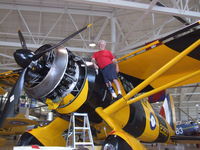 C-GCWL @ CYHM - Crewman is dwarfed by the beast-it has 50' wings, 870 HP, and a 12'6 prop- a real Piper Cub  on Steroids - by Jim Uber