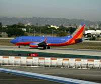 N394SW @ LAX - Southwest 1994 Boeing 737-3H4 in new colors with winglets - by Steve Nation