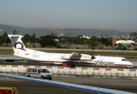 N404QX @ LAX - Horizon 2001 Bombardier DHC-8-402 taxiing - by Steve Nation