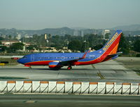 N467WN @ LAX - Southwest 2004 Boeing 737-7H4 in new colors w/winglets lined up for TO on Runway 24L - by Steve Nation