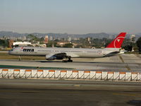 N594NW @ LAX - NWA Northwest Airlines 2003 757-351 rolling on RW 24L - by Steve Nation