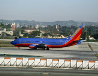 N675AA @ LAX - Southwest 1985 Boeing 737-3A4 in new colors w/o winglets rolling on RW 24L - by Steve Nation