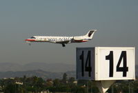 N807AE @ LAX - American Express proud sponsor MAKE A WISH 2001 Embraer EMB-135KL landing on RW 24L - by Steve Nation