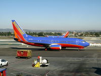 N907WN @ LAX - Southwest 2008 Boeing 737-7H4 in new colors w/winglets taxiing to gate - by Steve Nation