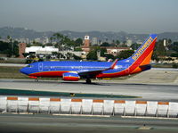 N907WN @ LAX - Southwest 2008 Boeing 737-7H4 in new colors w/winglets ready to roll on RW 24L - by Steve Nation