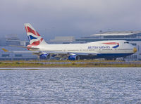 G-BNLD @ KSFO - Emerging from the terminal apron, this giant shows us in totally unusual golden nose. - by Philippe Bleus