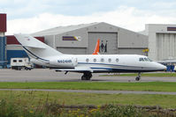 N404HR @ EGGW - Falcon 20 preparing depart Luton for its long flight back to the USA - don't get to photo too many Falcon 20s these days !! - by Terry Fletcher