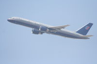 N595UA @ KLAX - United Airlines Boeing 757-222, N595UA departs KLAX RWY 25R - by Mark Kalfas