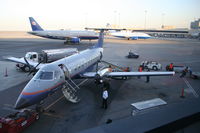 N295SW @ KSFO - SkyWest, (United Express) EMB-120ER, N295SW, at the gate KSFO with N485UA and N913UA in the backround. - by Mark Kalfas