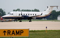 N534M @ KDPA - Menards Beech 1900D, taxiing to the ramp at KDPA, to pick up a group bound for KEAU. - by Mark Kalfas