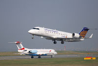 D-ACRL @ VIE - Canadair RJ200 with OE-LFJ in the background - by Chris J