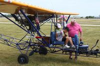 N3AZ @ OSH - Getting strapped in for a ride at Airventure 2009 - Oshkosh, Wisconsin - by Bob Simmermon