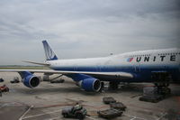 N198UA @ KORD - United Airlines Boeing 747-422, N198UA at KORD gate C18 loading up for a trip to ZBAA - by Mark Kalfas