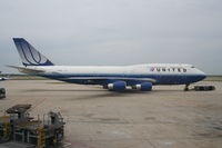 N198UA @ KORD - United Airlines Boeing 747-422, N198UA at KORD pushing back C18 for a trip to ZBAA. - by Mark Kalfas