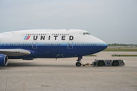 N198UA @ KORD - United Airlines Boeing 747-422, N198UA at KORD pushing back C18 for a trip to ZBAA. - by Mark Kalfas