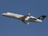 S5-AAG @ EBBR - Regional jet with Star Alliance special scheme climbing from rwy 25R. - by Philippe Bleus