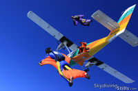 N121PM @ 26MA - Wingsuit skydivers exit the oldest Twin Otter jump plane over Pepperell, MA - by Dave G