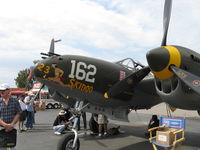 N138AM @ CMA - 1943 Lockheed P-38J LIGHTNING '23 Skidoo', two Allison V1710-89/91 1,425 Hp each. Nose art - by Doug Robertson