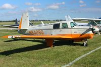N6409Q @ I74 - At the MERFI fly-in, Urbana, Ohio.  Note the BT-13 landing in the background. - by Bob Simmermon