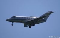 N16GH @ IAD - Short final to Dulles - by Paul Perry