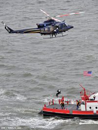 N2SP - Hoist in the Delaware Bay to the Wilmington fire boat Fire Fighter - by John Randolph