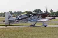 C-FWON @ KOSH - Taxi for departure - by Todd Royer