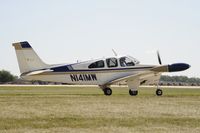 N141MW @ KOSH - Taxi to parking - by Todd Royer