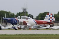 N260DC @ KOSH - Departing OSH on 27 - by Todd Royer