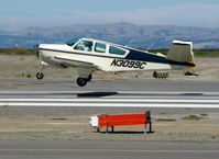N3099C @ SQL - Immaculate 1958 Beech K35 about to touchdown (Love the Bonanza!) - by Steve Nation
