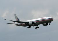 N751AN @ DFW - American 777 landing on 18R at DFW after a long flight from Tokyo Narita. A rainy day a Dallas! - by paulp