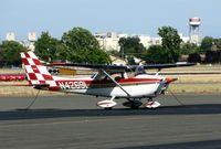 N4269L @ SAC - Red & white checkered tail 1966 Cessna 172G visiting from CCR (Concord, CA) with Campbell's Soup factory water tank in background - by Steve Nation