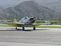 N817TX @ SZP - 1942 North American AT-6D 'Problem Child', P&W R-1340 Wasp 600 Hp, taxi off Rwy 22 - by Doug Robertson