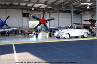 N201TB @ ESN - in hangar with other adult toys - by J.G. Handelman