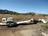 N4201S @ 1O2 - Hulk of 1978 Mooney M20J (no NTSB accident report found) at Lampson Field boneyard - by Steve Nation