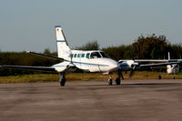 D-IAAZ @ EGGP - Cessna 404 Titan Courier 2 - by Chris Hall