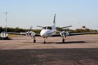 D-IAAZ @ EGGP - Cessna 404 Titan Courier 2 - by Chris Hall