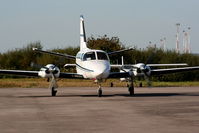 D-IAAZ @ EGGP - Cessna 404 Titan Courier 2 - by Chris Hall