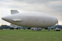 G-SKSC @ EGTT - Airship Industries (uk) Ltd SKYSHIP 600. We flew in this airship on my wifes birthday on a circular route around rural Bedfordshire. Alas, no longer possible! Shown here at her mobile mooring mast. - by Malcolm Clarke