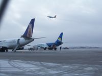 C-GNWN @ CYRT - C-GNWN taking off, Rankin Inlet, NU  2009oct26 with C-FNVK and unknown Canadian North 737 in foreground - by Philippesdad