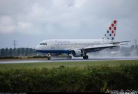 9A-CTI @ EHAM - Landing in bad Wether - by Jan Lefers
