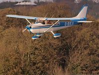 G-BKII @ EGHR - landing at Goodwood with autumnal background - by trevorc28