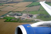 G-DBCF @ EGNV - Airbus A319-131 on take-off from Durham Tees Valley showing the fire training area. - by Malcolm Clarke