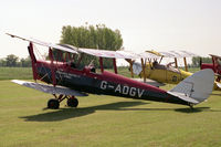 G-ADGV @ EGTH - De Havilland DH-82A Tiger Moth II. Behind is DH82A G-ANFM. At Old Warden's De Havilland Day in 1989. - by Malcolm Clarke