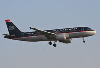 N123UW @ KORD - US AIRWAYS A320-214, AWE1996 arriving from KPHL, short final 22R KORD. - by Mark Kalfas