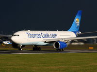 G-TCXA @ EGCC - Thomas Cook Airlines A330 departing from RW 23L as the storm clouds roll in - by Chris Hall