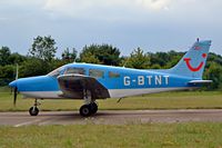 G-BTNT @ EGBP - Piper PA-28-151 Cherokee Warrior [28-7615401] Kemble~G 11/07/2004. Seen at the PFA Fly in 2004 Kemble UK taxiing out for departure. - by Ray Barber