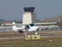 N196RE @ POC - Taxiing back for take off, Tower in the background - by Helicopterfriend