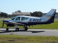 G-RCED @ EGHH - Taken from the Flying Club - by planemad
