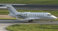HB-JRE @ TNCM - HB-JRE taxing to parking at the cargo ramp - by Daniel Jef