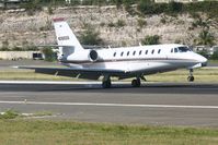 N389QS @ TNCM - N389QS landing at TNCM on runway 10 - by Daniel JEf